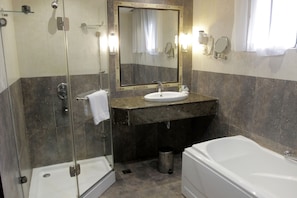 Suite, 2 Bedrooms | Bathroom | Separate tub and shower, spring water tub, free toiletries, hair dryer