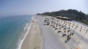 On the beach, white sand, free beach shuttle, sun-loungers