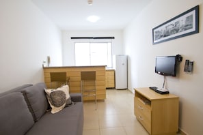 Apartment, 2 Single Beds | Living room | 26-inch LCD TV with cable channels, TV - Oscar Freire Suítes São Paulo (Sao Paulo)
