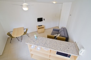Apartment, 1 Double Bed | Living room | 26-inch LCD TV with cable channels, TV - Oscar Freire Suítes São Paulo (Sao Paulo)