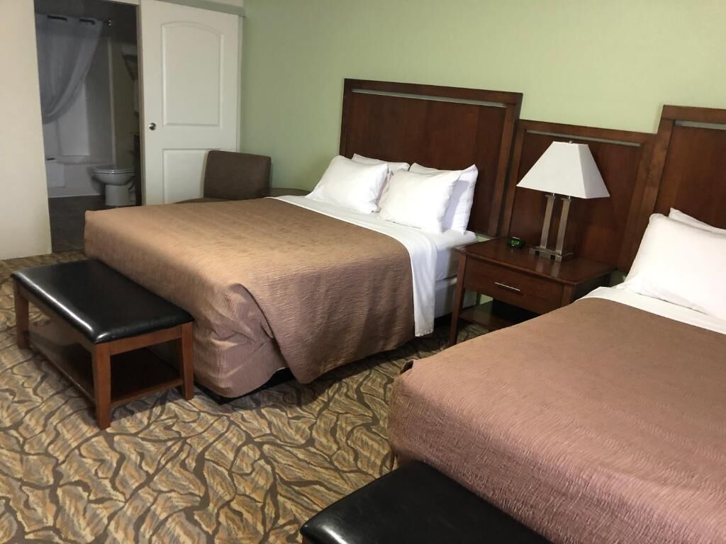 extended stay suite, 2 queen beds | premium bedding, desk, laptop workspace, blackout curtains