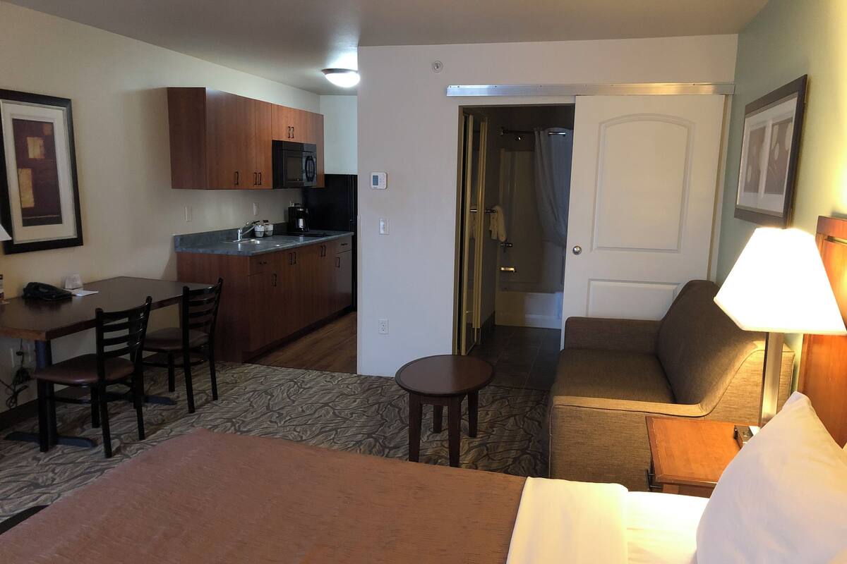 Extended Stay Suite, 1 Queen Bed | Premium bedding, desk, laptop workspace, blackout curtains