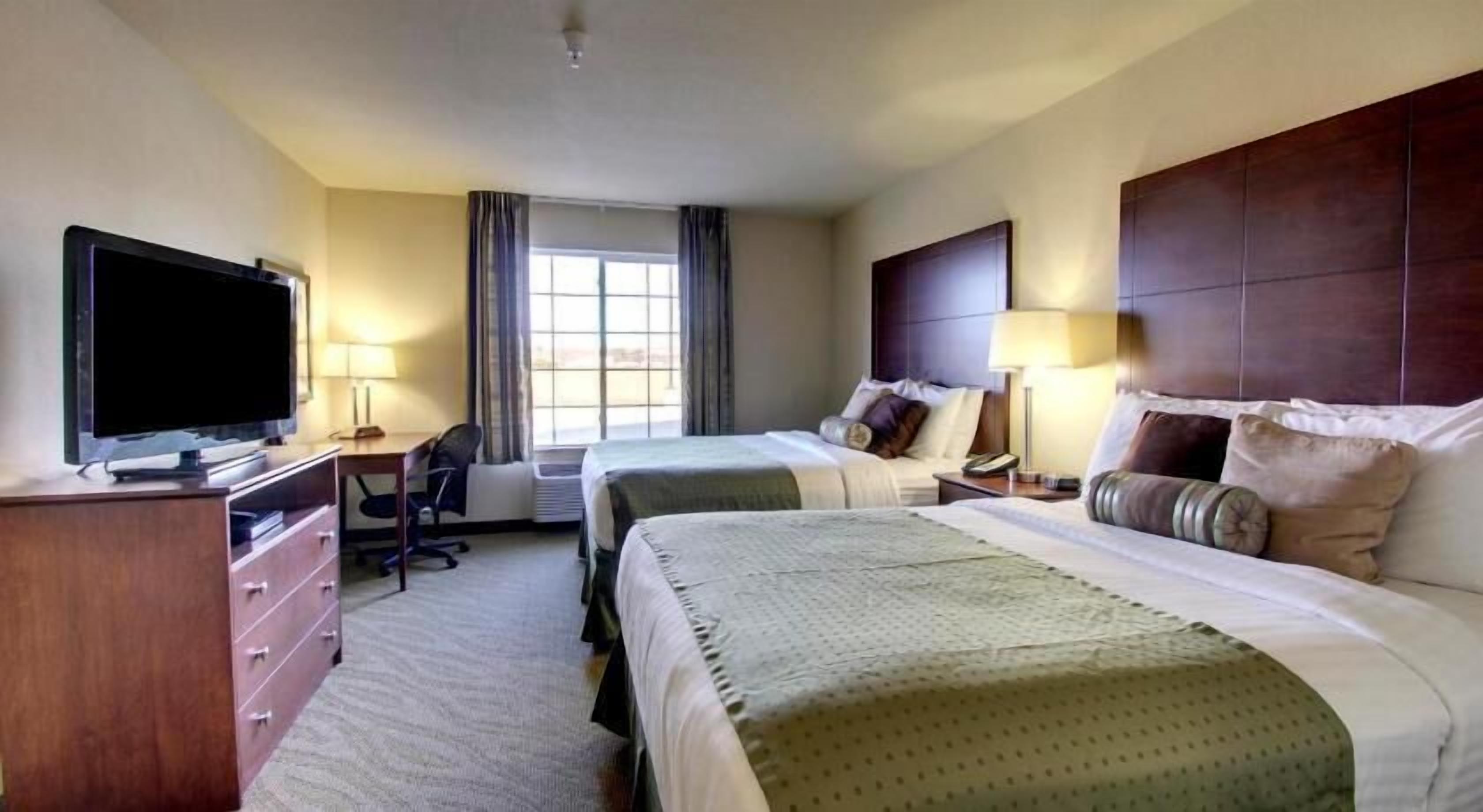 Premium bedding, desk, laptop workspace, free WiFi