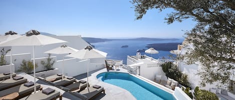 Outdoor pool, open 9:00 AM to 9:00 PM, pool umbrellas, pool loungers