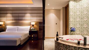 Premium bedding, down comforters, pillowtop beds, minibar