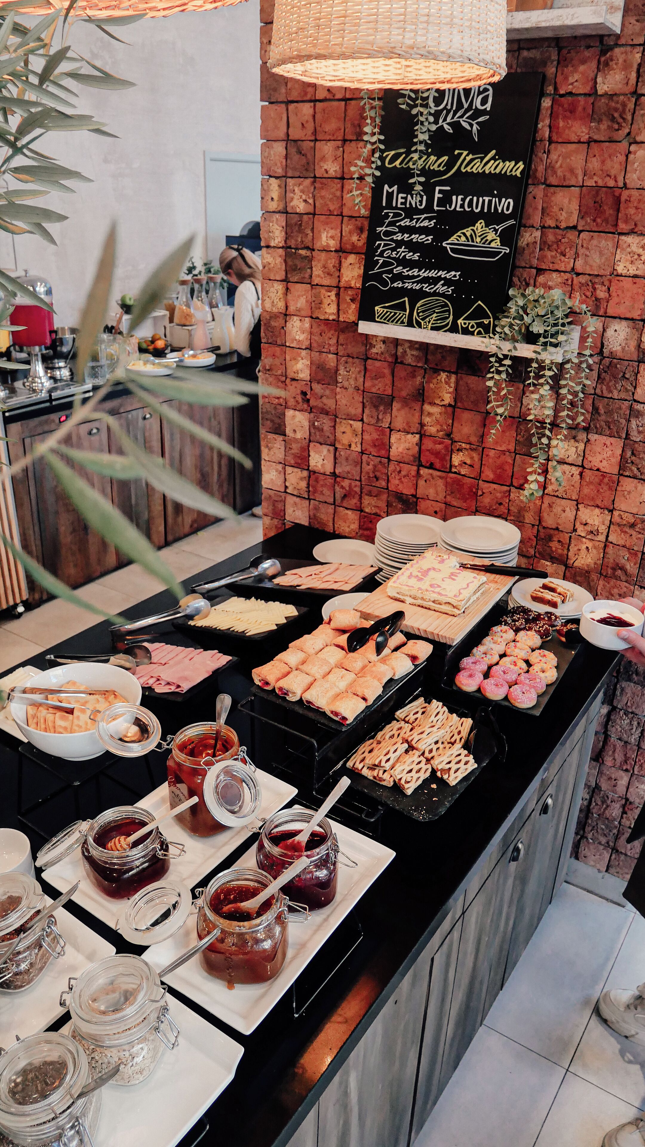 A buffet with various food items and condiments.
