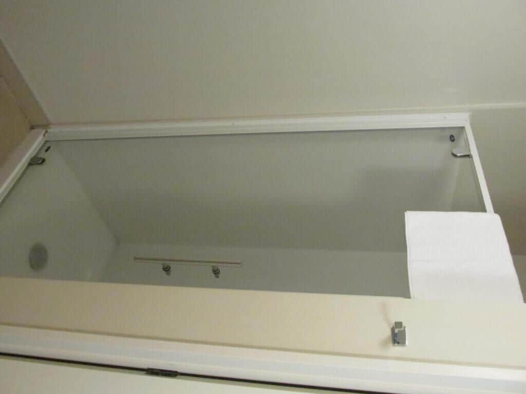 A room with a large, empty glass partition.
