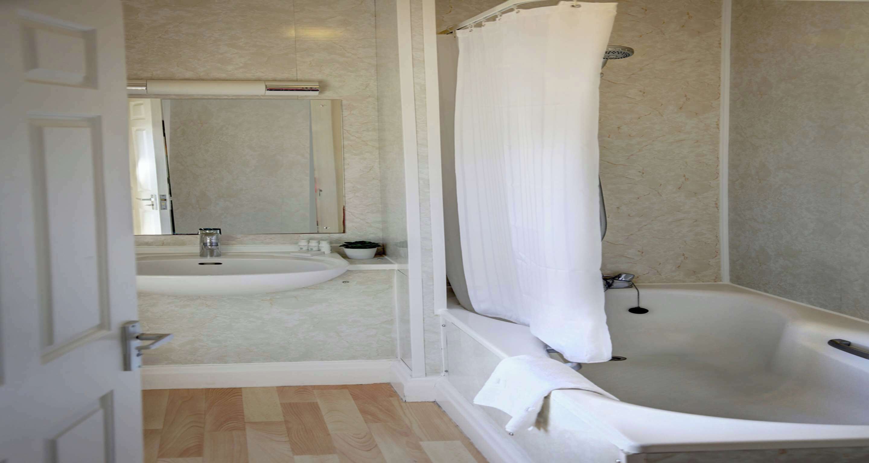 eco-friendly toiletries, hair dryer, towels, soap