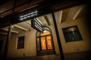 The entrance to Whyla Playford Apartments with a sign above the door.