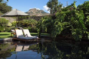 Outdoor pool, open 9 AM to 6:00 PM, pool umbrellas, sun loungers