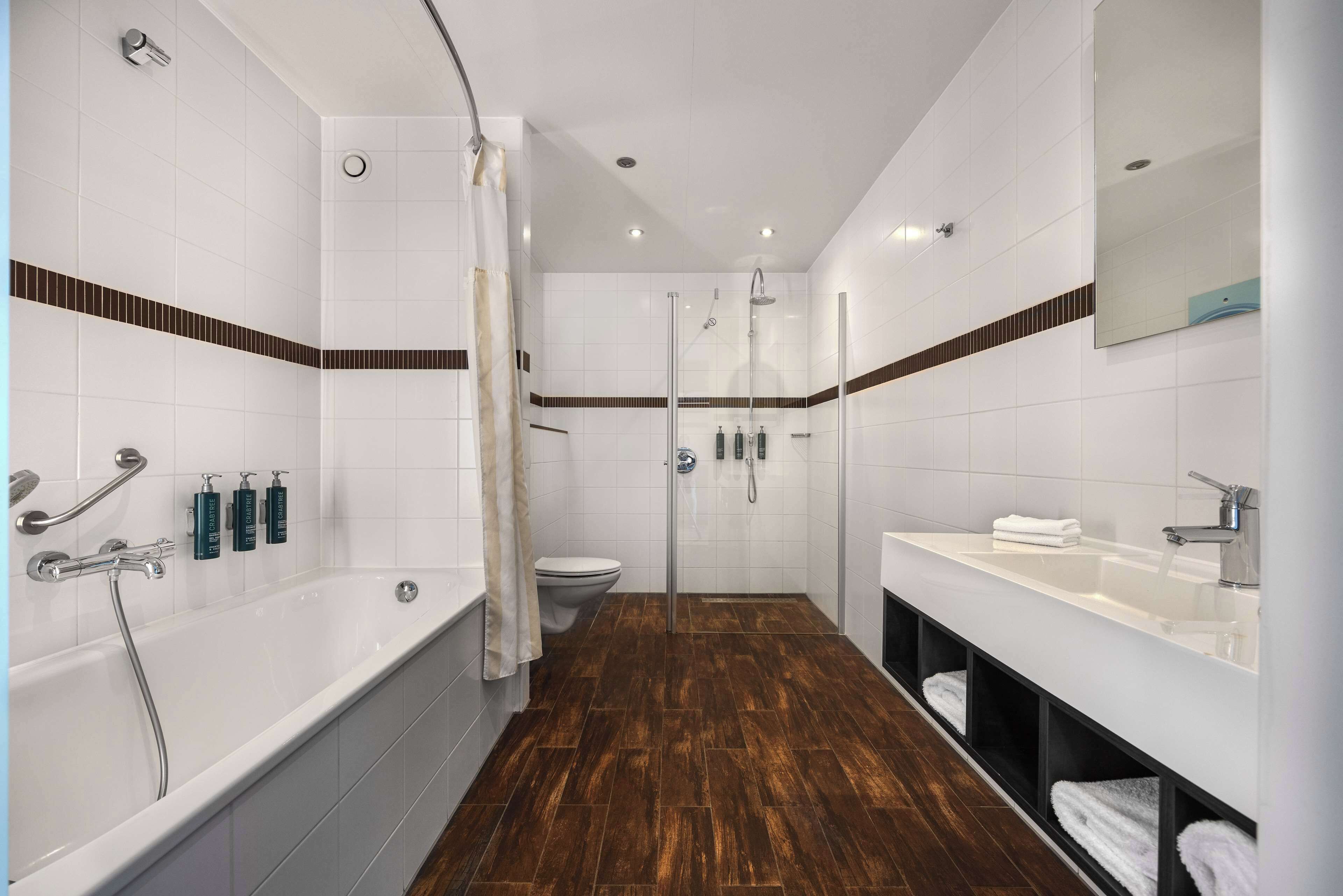 deluxe room, 1 king bed | bathroom | shower, free toiletries, hair dryer, towels