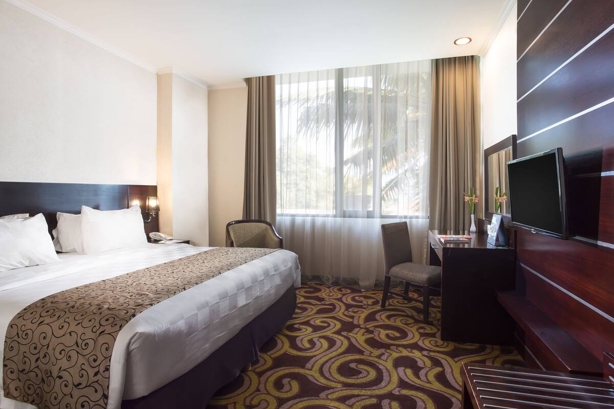 Minibar, desk, blackout drapes, iron/ironing board