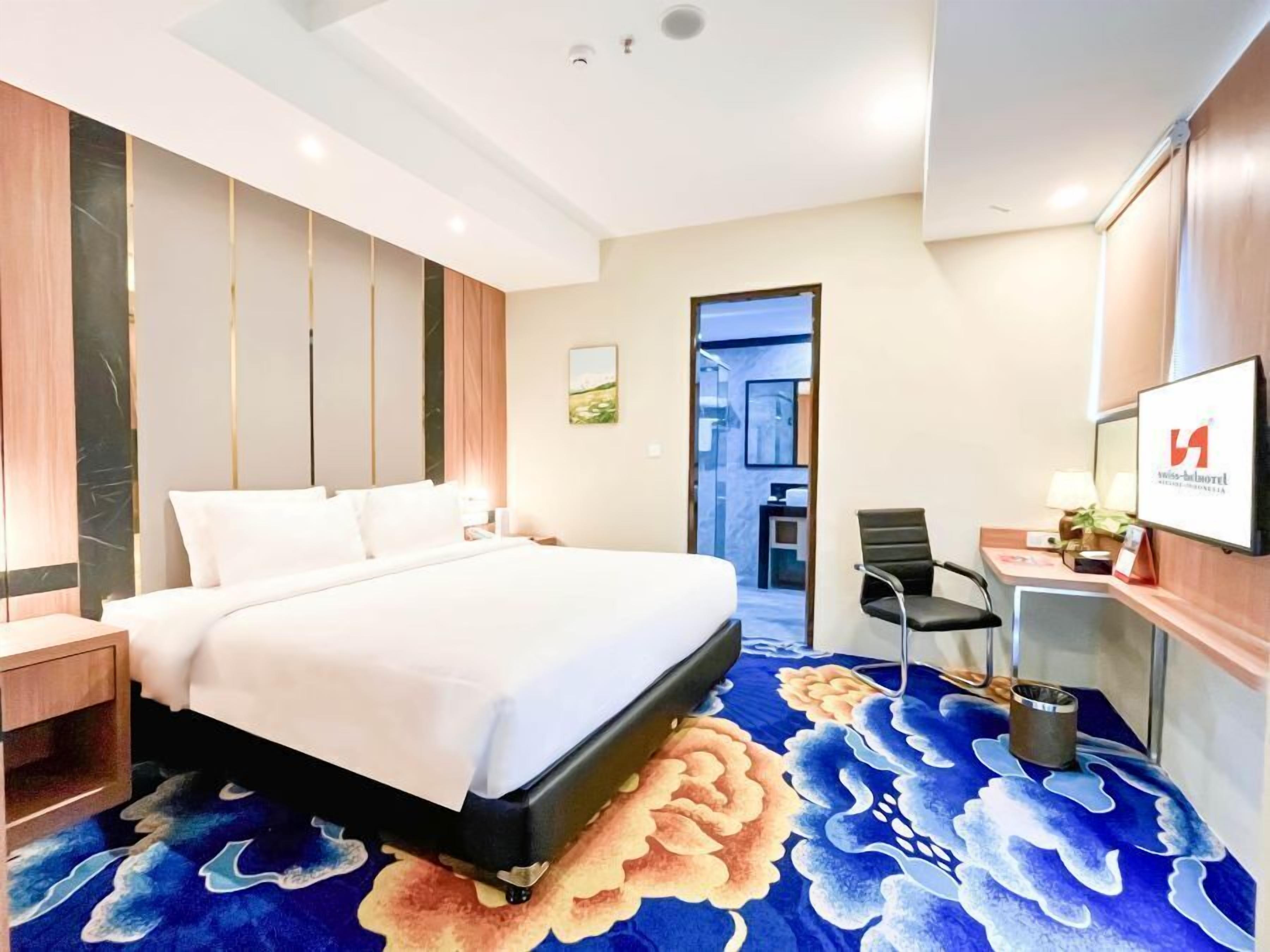 Minibar, desk, blackout curtains, iron/ironing board