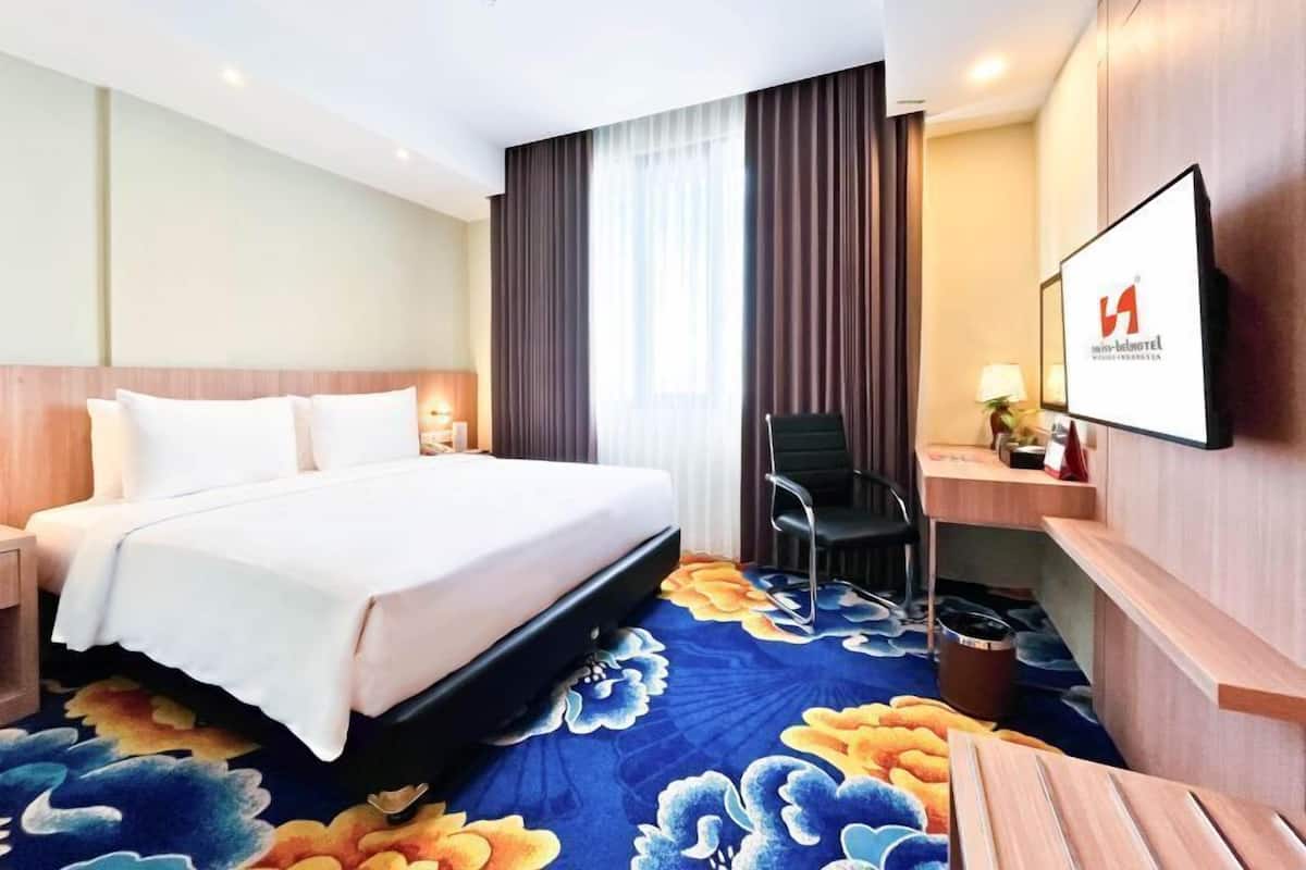 Minibar, desk, blackout drapes, iron/ironing board