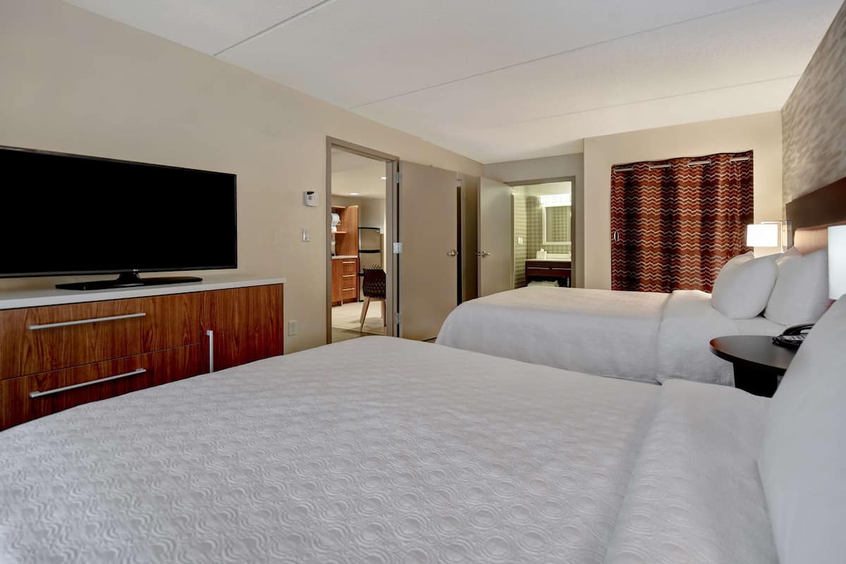 Hypo-allergenic bedding, desk, laptop workspace, blackout curtains