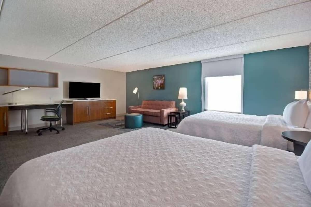 Hypo-allergenic bedding, desk, laptop workspace, blackout curtains