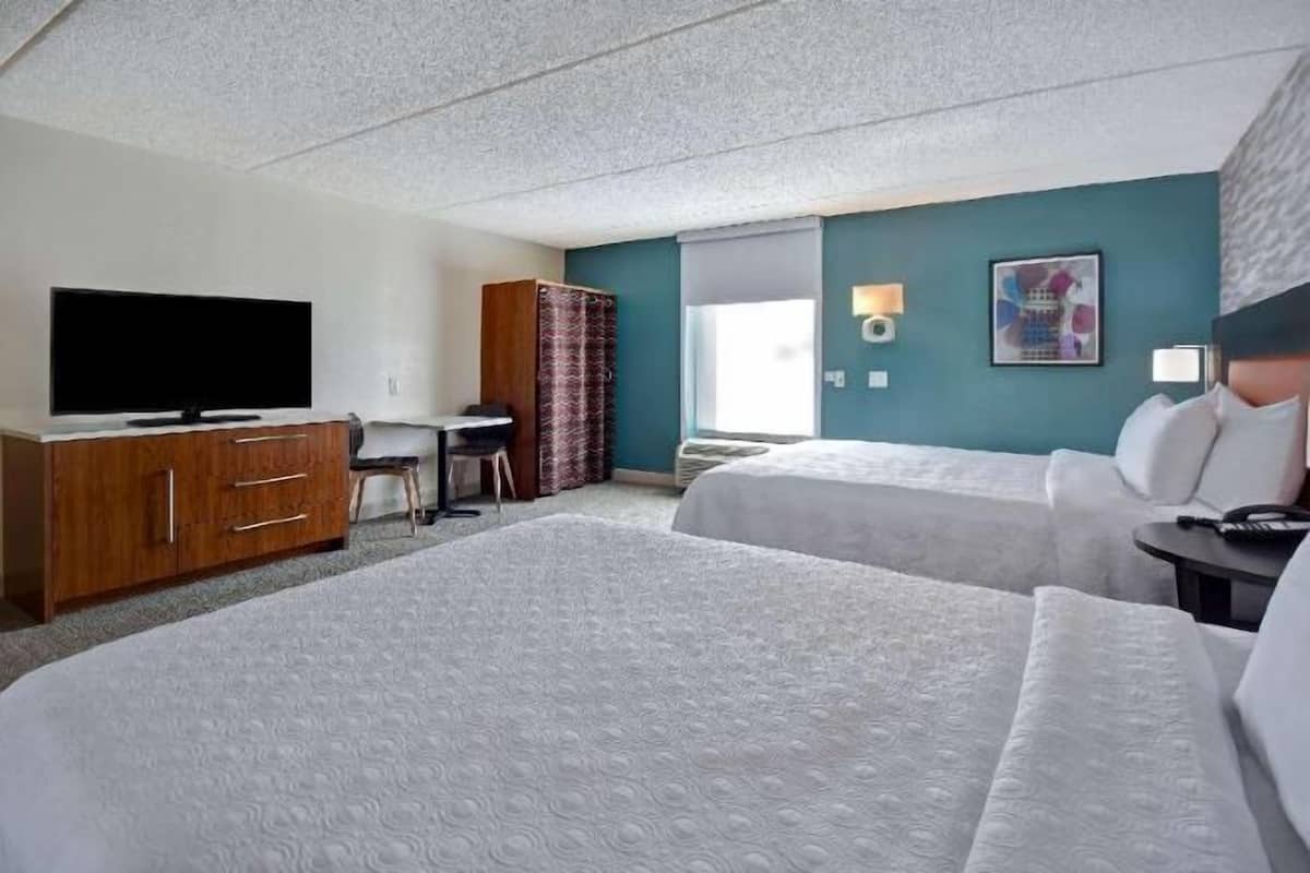 Hypo-allergenic bedding, desk, laptop workspace, blackout curtains