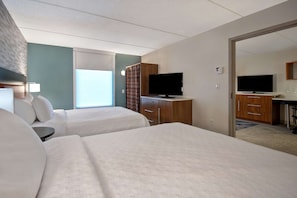 Hypo-allergenic bedding, desk, laptop workspace, blackout drapes