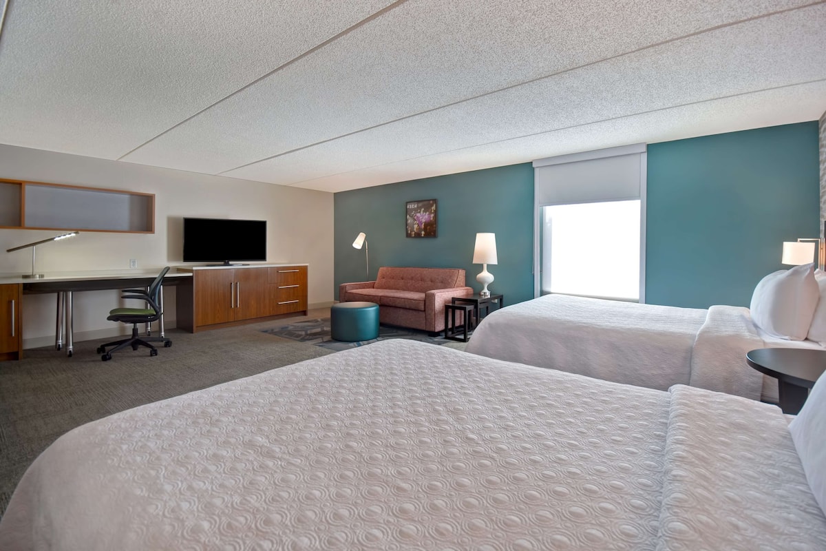 Hypo-allergenic bedding, desk, laptop workspace, blackout curtains