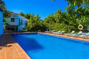 Seasonal outdoor pool, open 11:00 AM to 9:00 PM, pool loungers