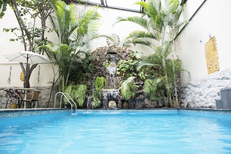 Outdoor pool, open 10:00 AM to 10:00 PM, sun loungers