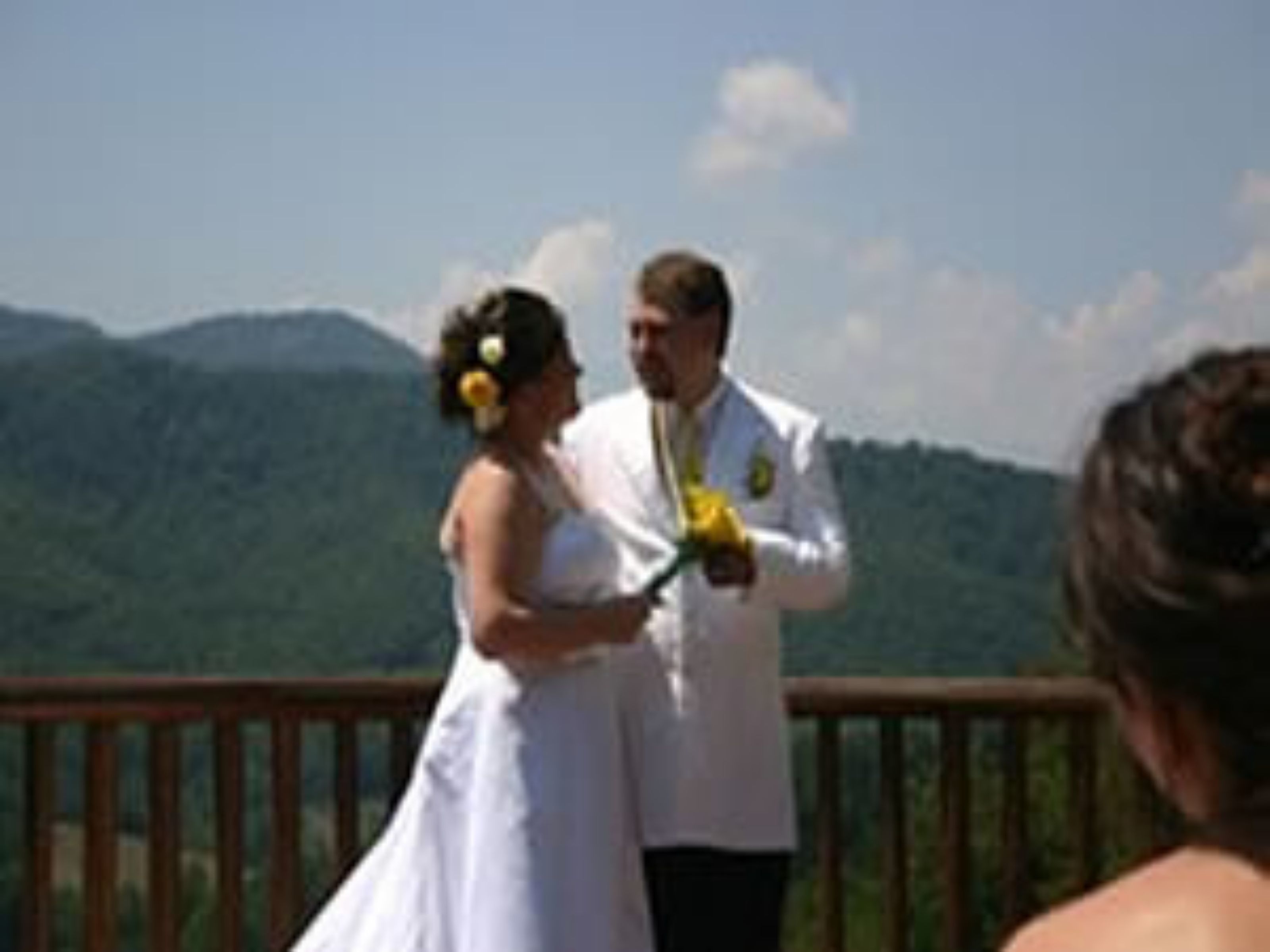 A wedding ceremony with a mountainous backdrop.