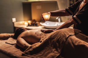 Experience a serene spa setting with a soothing massage table and tranquil ambiance.
