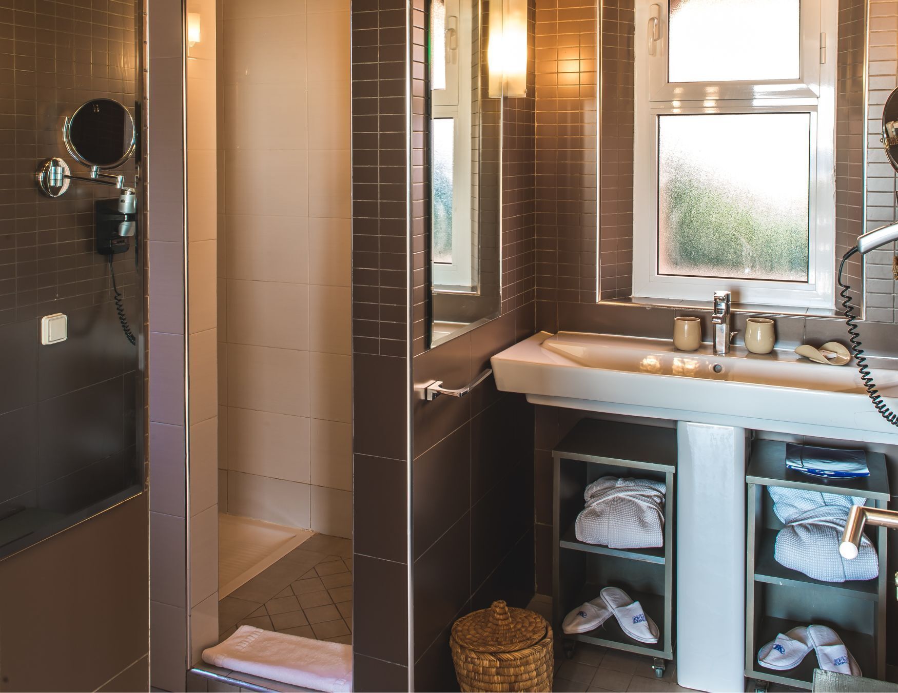 Shower, designer toiletries, hair dryer, slippers