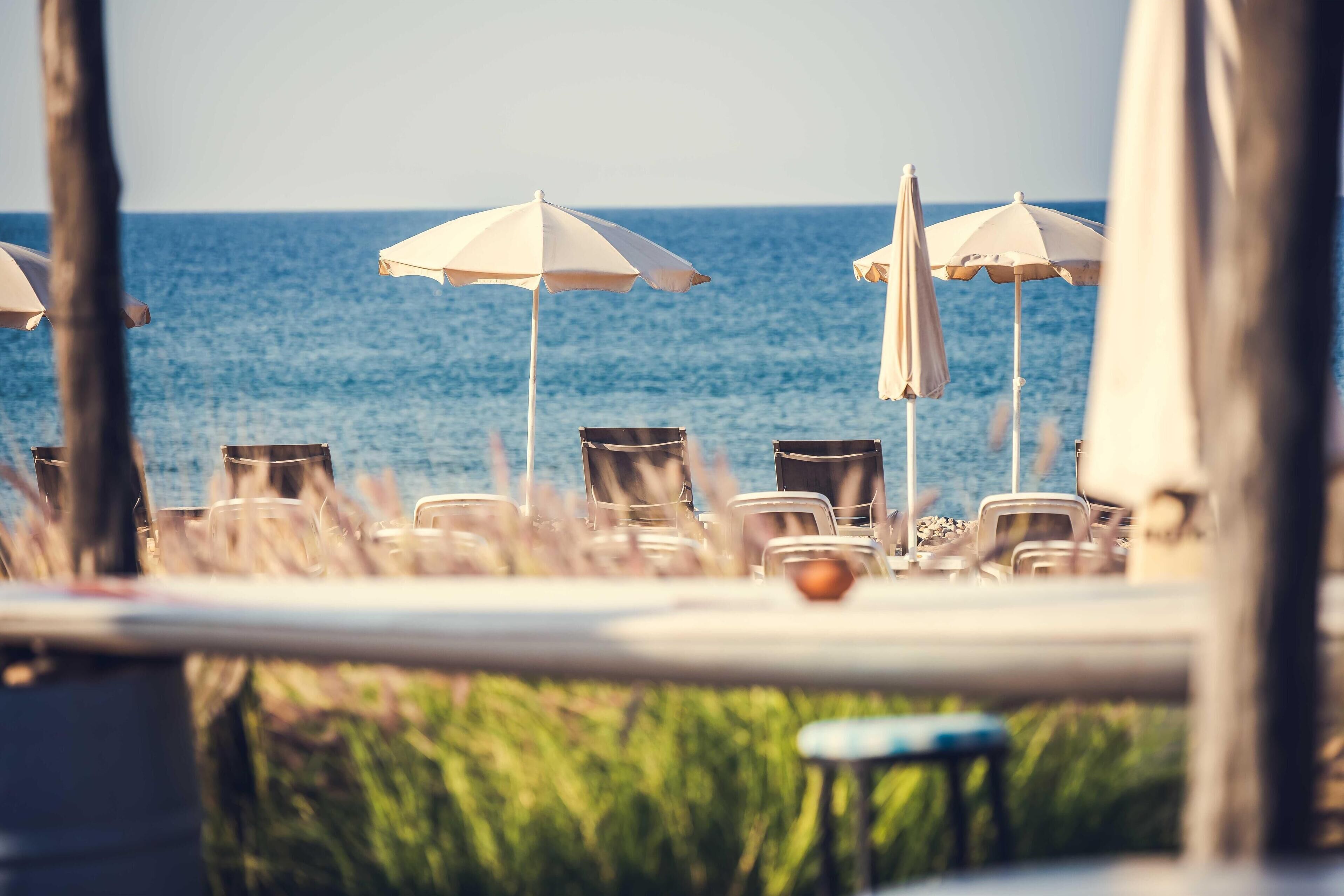 private beach, sun-loungers, beach umbrellas, beach towels