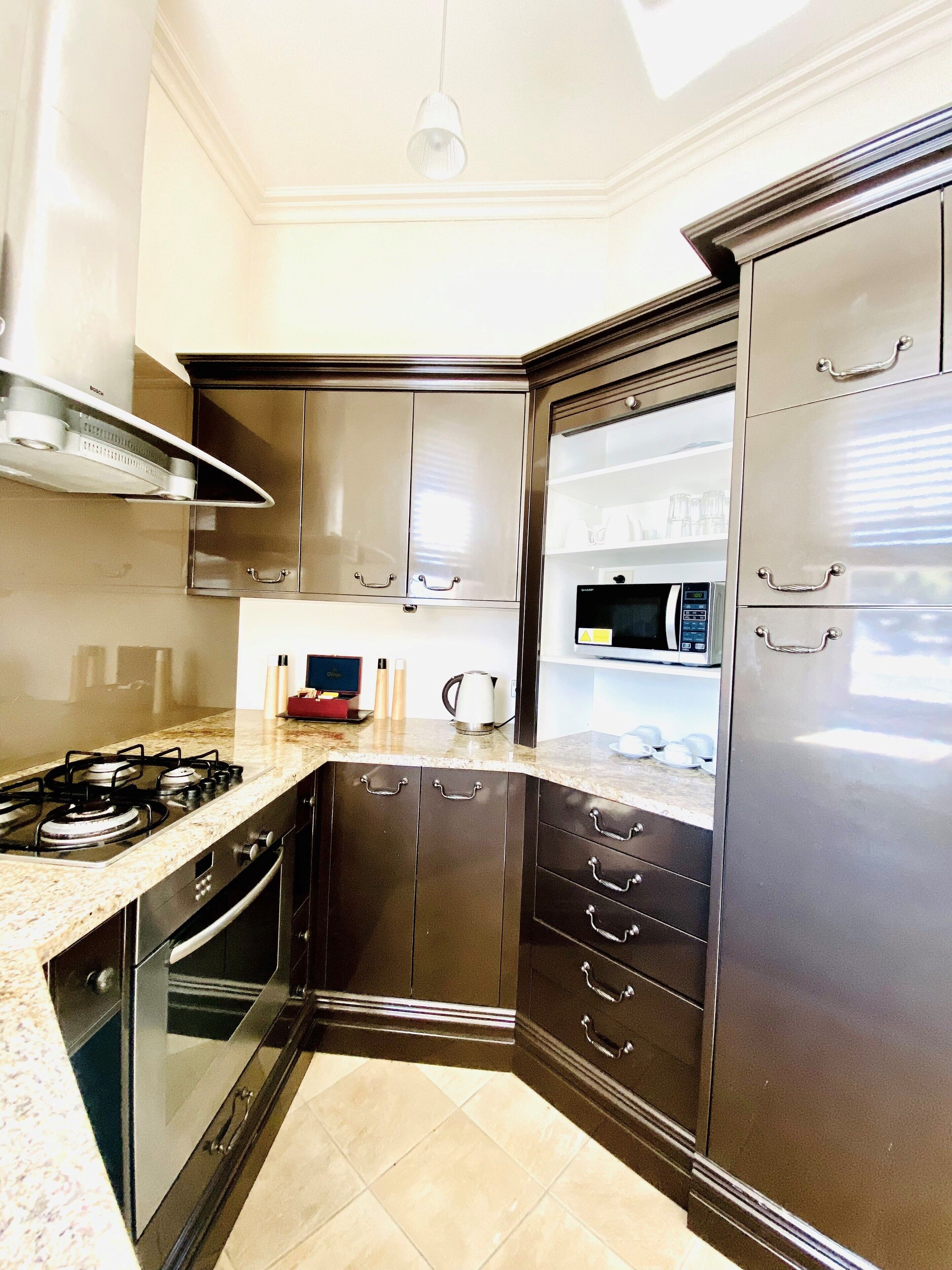 mini-fridge, coffee/tea maker, electric kettle, high chair