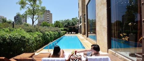 Seasonal outdoor pool, pool umbrellas, pool loungers