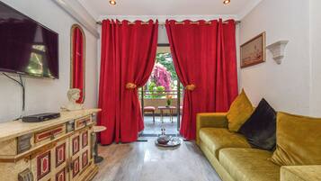 Deluxe Rooms | Area keluarga | TV LED