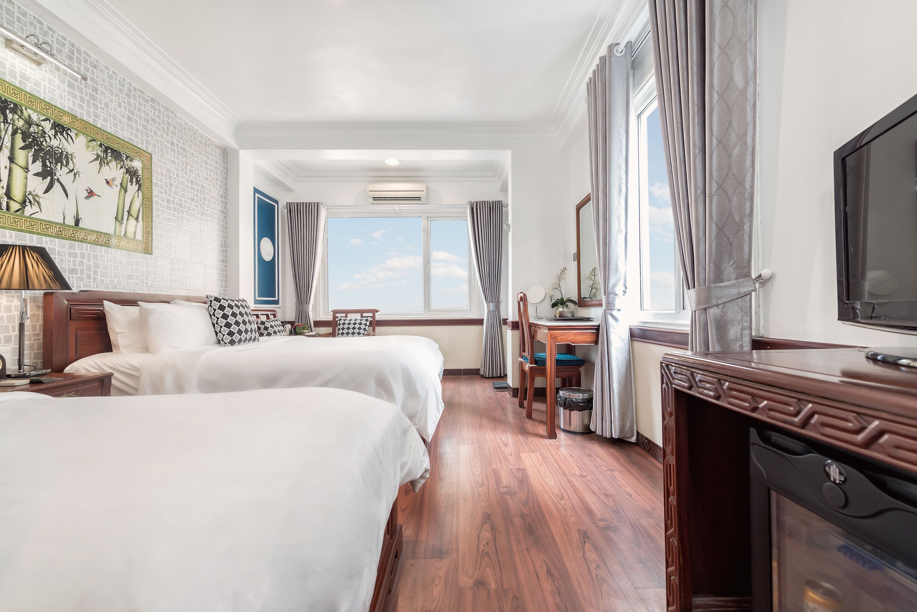 Family Triple Room, 1 Bedroom, City View | Living area | 32-inch Smart TV with cable channels, TV, computer