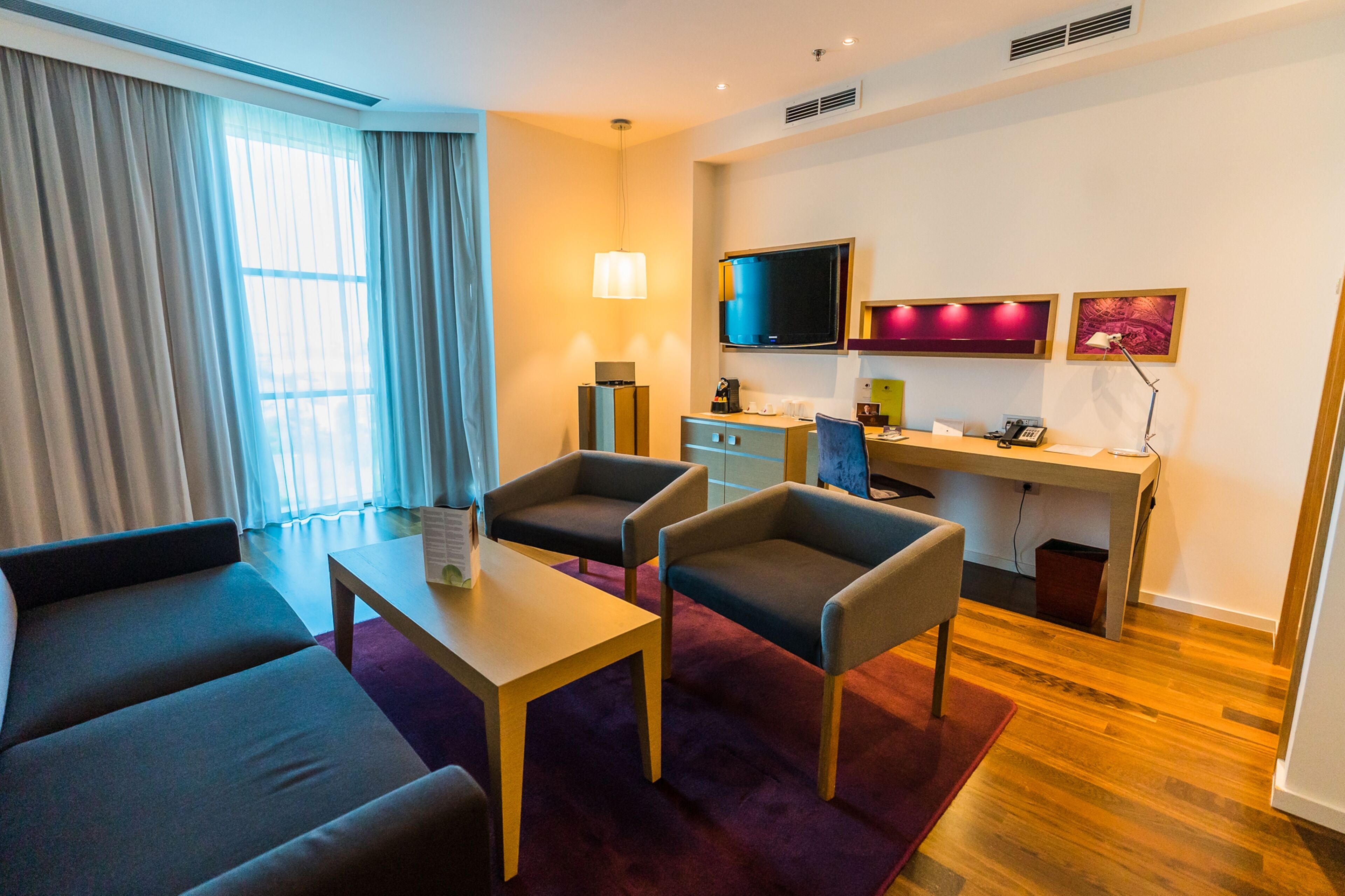 king one bedroom suite | living area | 37-inch lcd tv with cable channels, tv, ipod dock