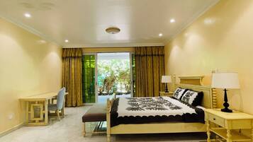 Deluxe Villa, 1 Bedroom, Garden View | Living area | 1-inch Smart TV with digital channels