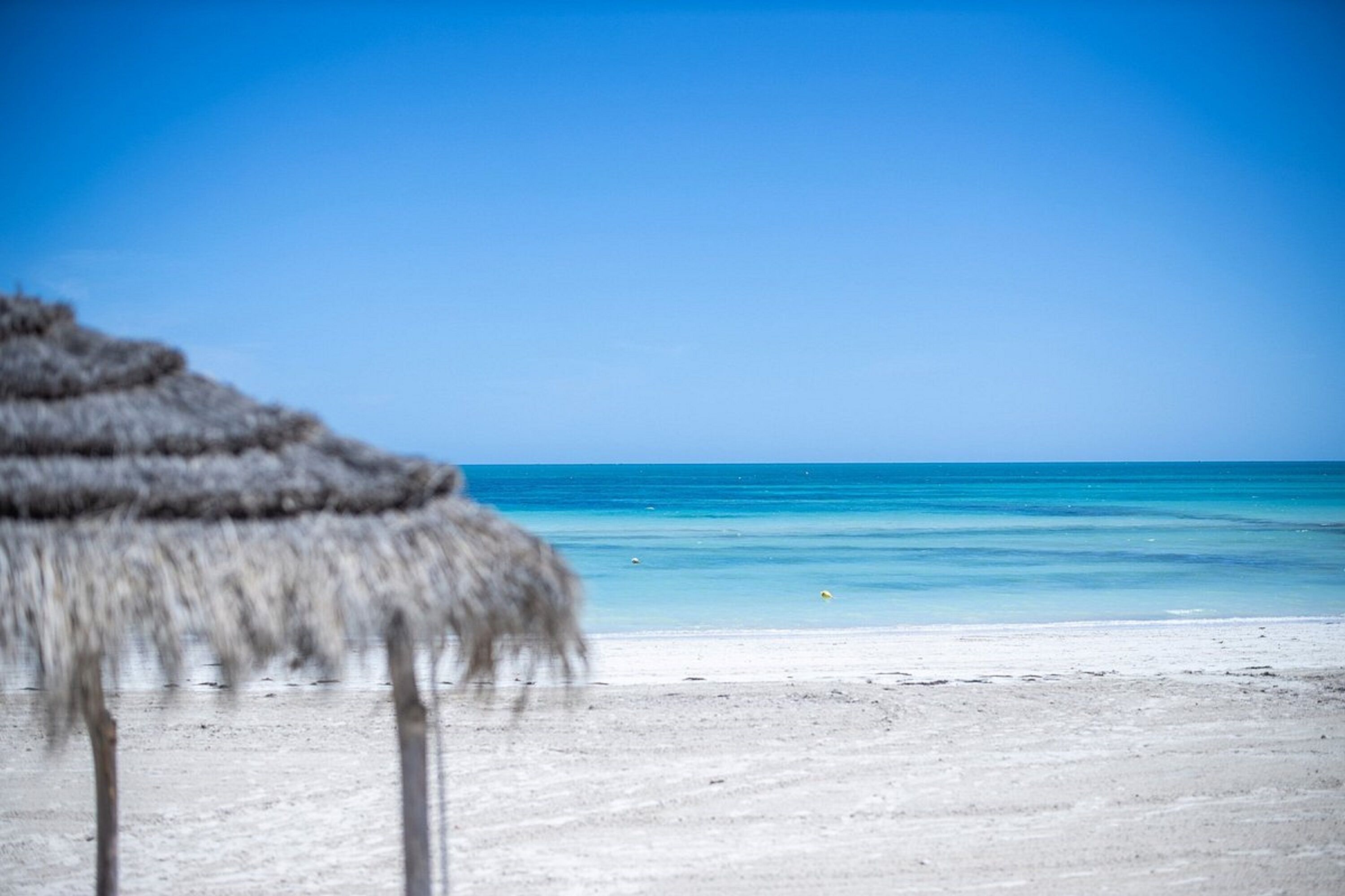On the beach, sun-loungers, beach umbrellas