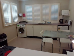 Fridge, microwave, stovetop, coffee/tea maker