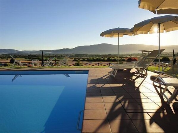 Outdoor pool, pool umbrellas, pool loungers