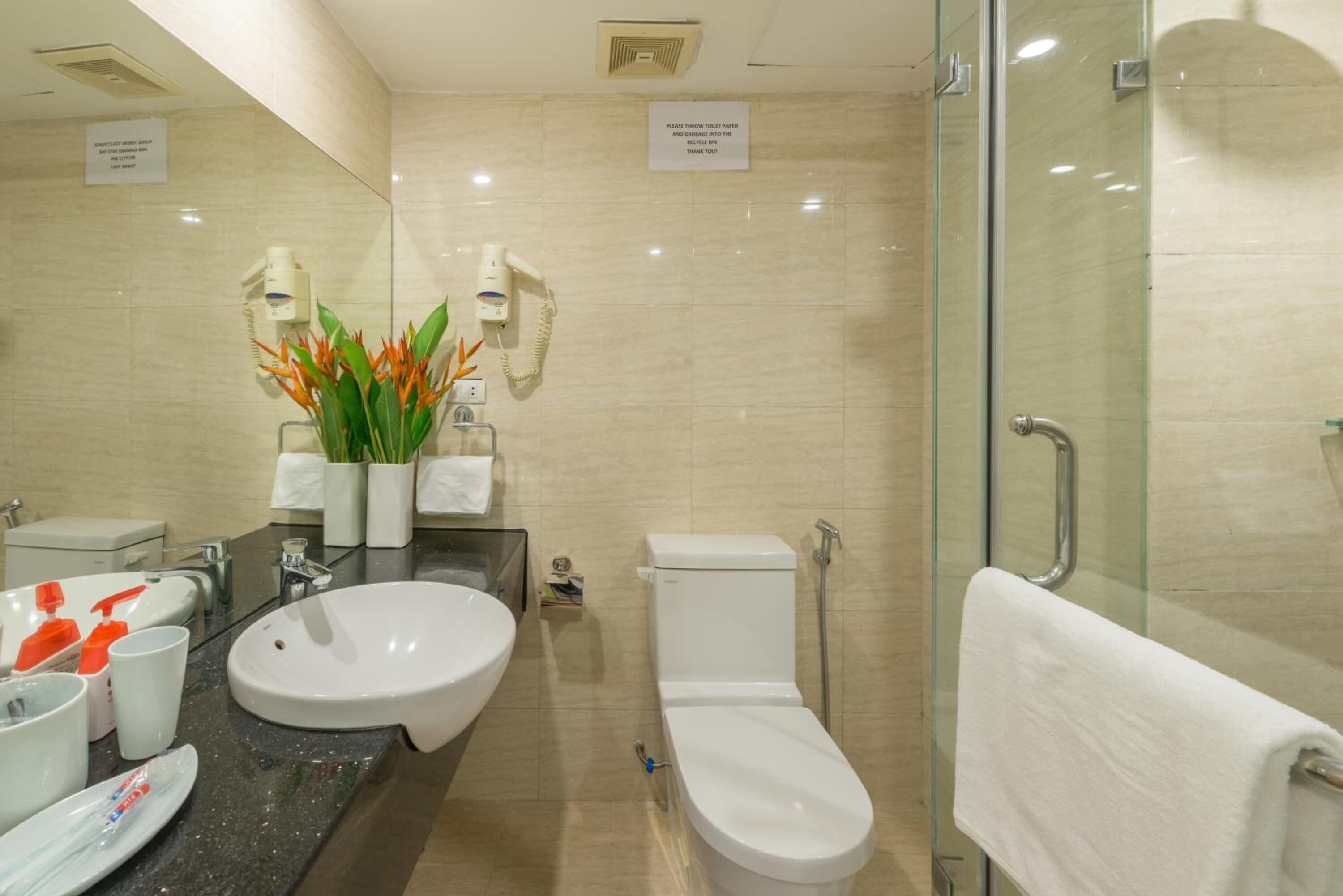 designer toiletries, slippers, towels