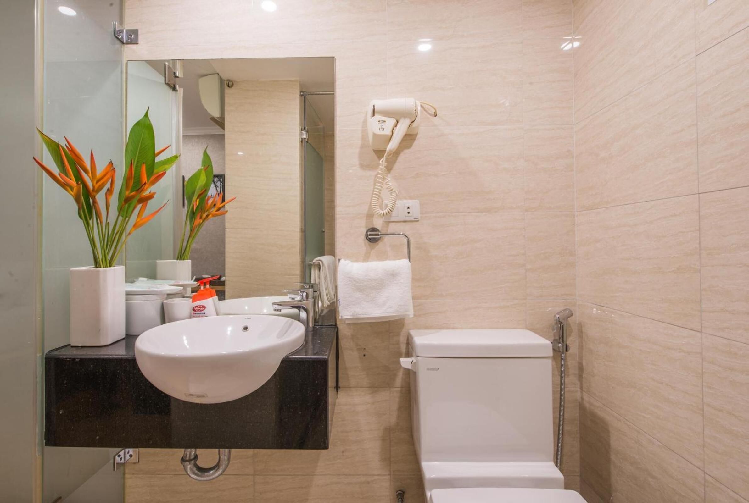 designer toiletries, slippers, towels