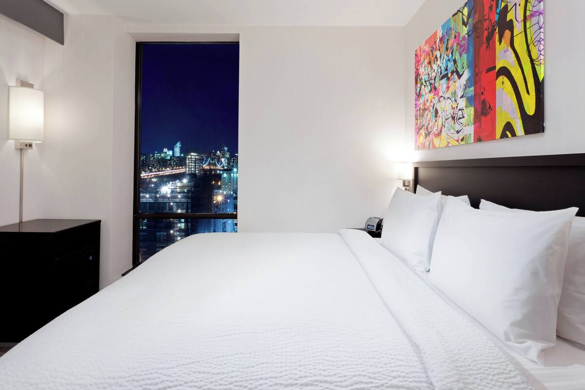 Hypo-allergenic bedding, down duvets, pillow-top beds, in-room safe
