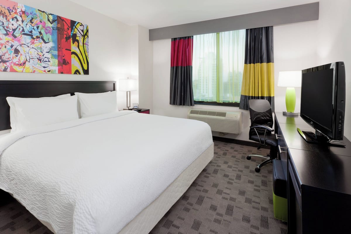 Hypo-allergenic bedding, down duvets, pillow-top beds, in-room safe