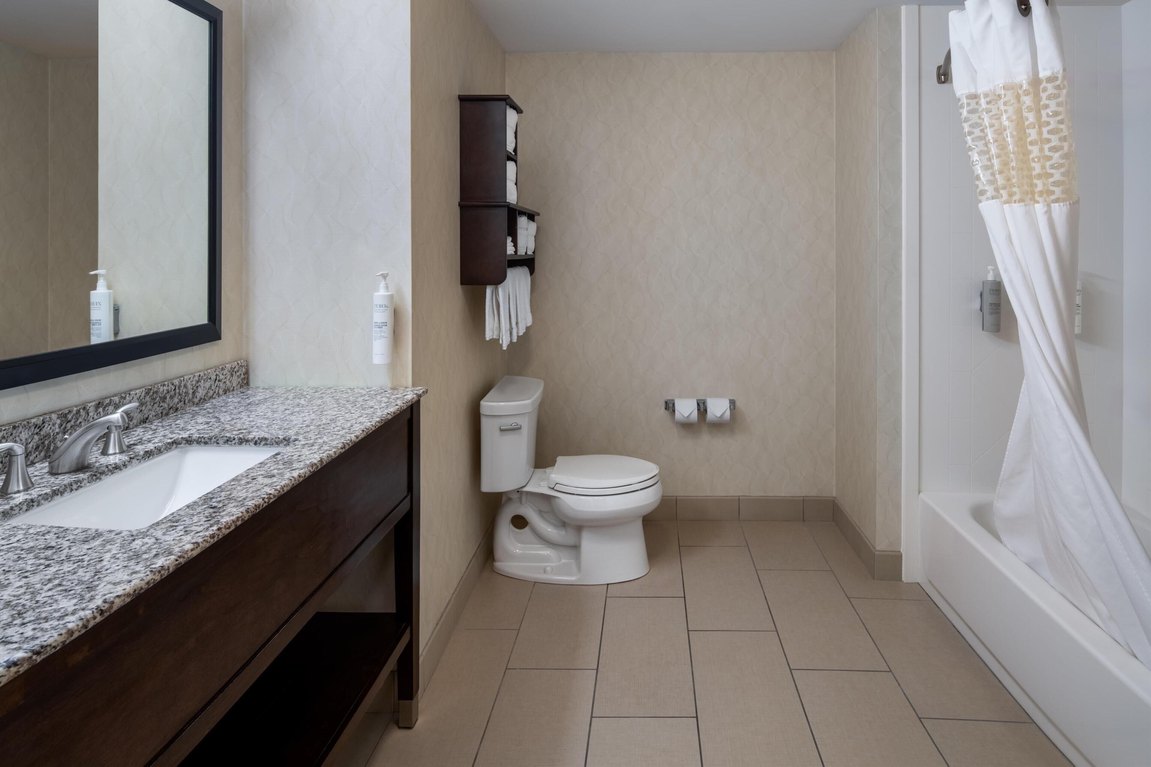 two queen beds | bathroom | shower, free toiletries, hair dryer, towels