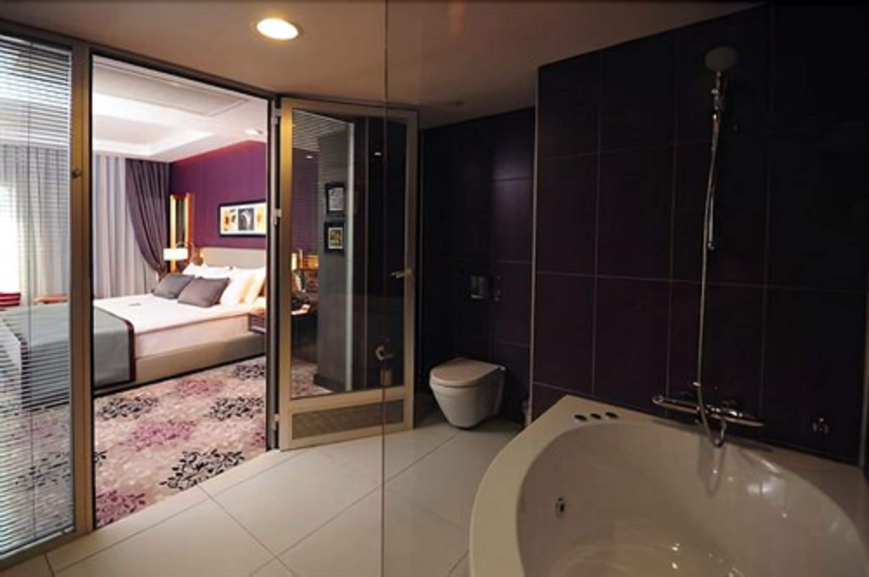 suite, 1 king bed, smoking, terrace | bathroom | designer toiletries, hair dryer, bathrobes, slippers