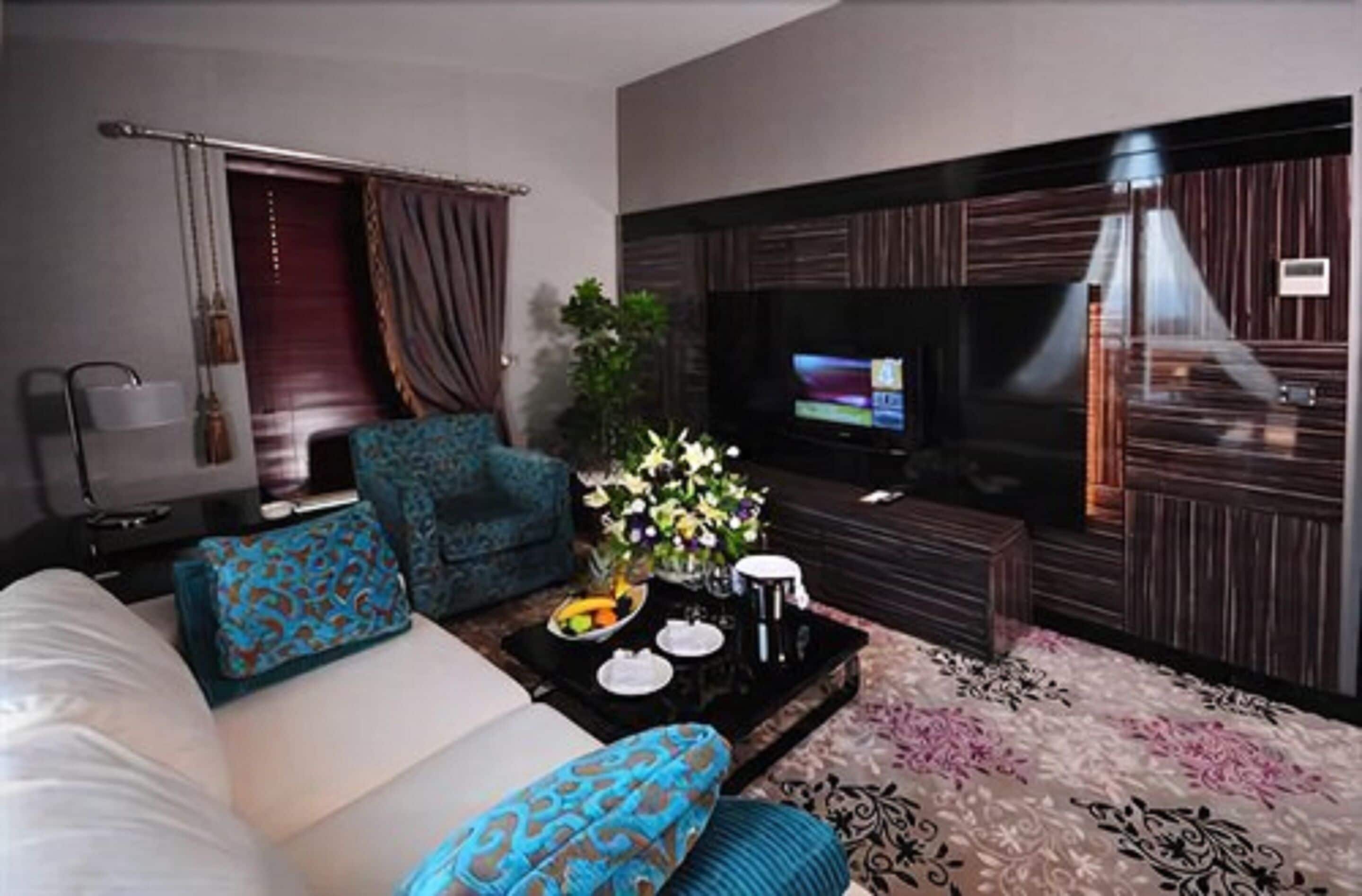 suite, 1 king bed, smoking, terrace | living area | lcd tv