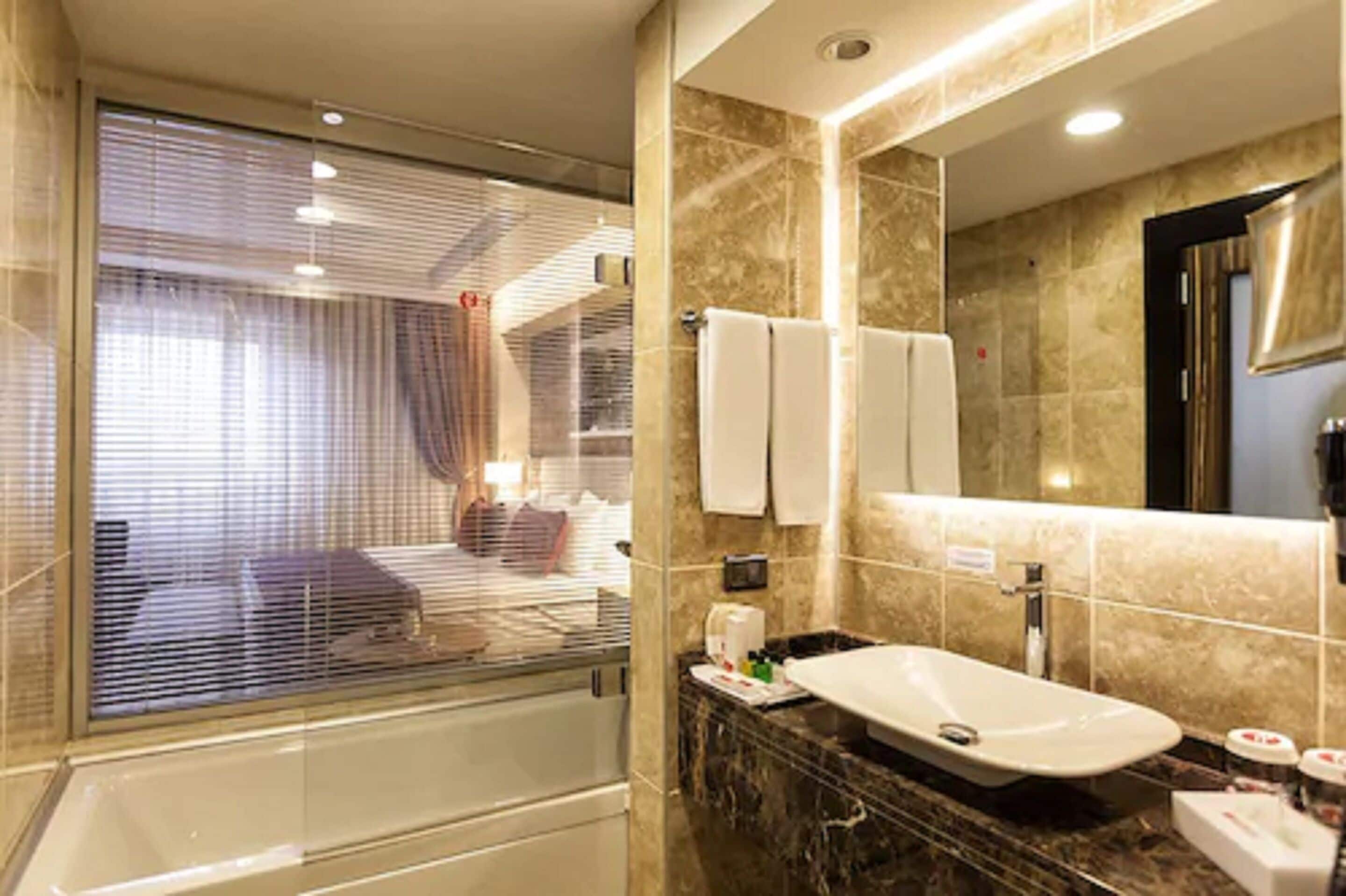 designer toiletries, hair dryer, bathrobes, slippers