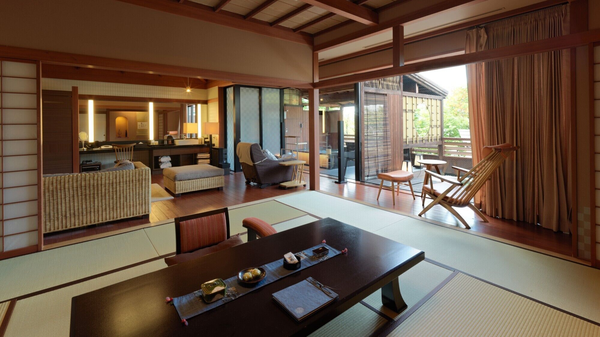 A traditional Japanese-style room with tatami flooring, a low table with a tray, and a view of the outside.