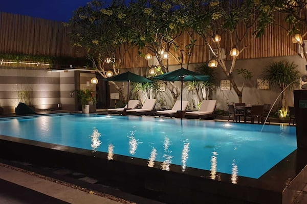 Outdoor pool, open 7:00 AM to 10:00 PM, pool umbrellas, sun loungers