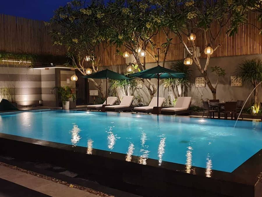 Outdoor pool, open 7:00 AM to 10:00 PM, pool umbrellas, sun loungers