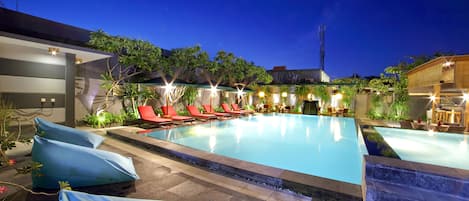 Outdoor pool, open 7:00 AM to 10:00 PM, pool umbrellas, pool loungers